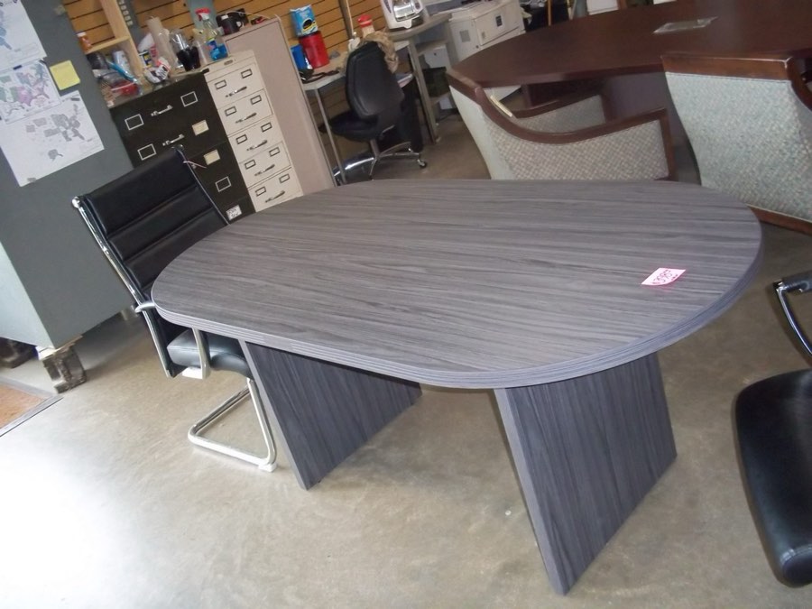 A new six-foot slate grey boat-shaped conference table.