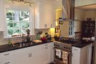 kitchen stove, sink, cabinets