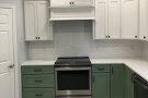 kitchen stove, counters, and cabinets