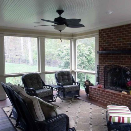 screened porch with fireplace